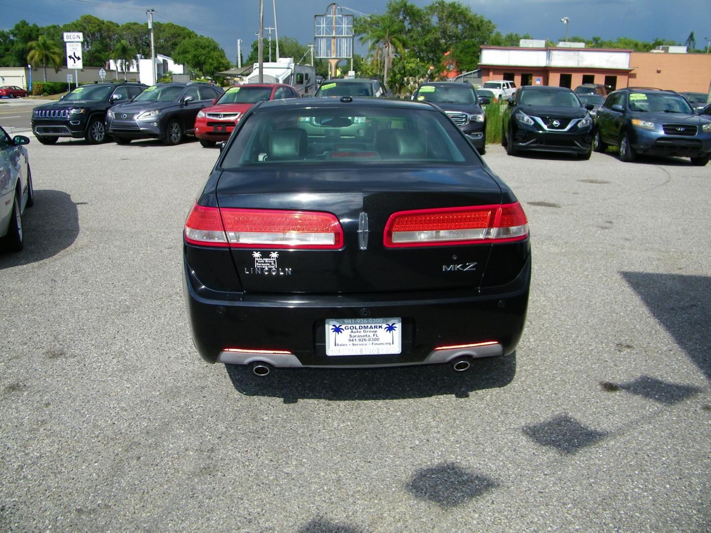 2011 Black /Black Lincoln MKZ FWD (3LNHL2GC0BR) with an 3.5L V6 DOHC 24V engine, 6-Speed Automatic transmission, located at 4000 Bee Ridge Road, Sarasota, FL, 34233, (941) 926-0300, 27.298664, -82.489151 - Photo#5